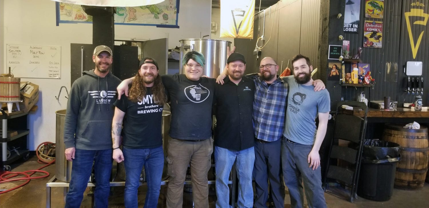 A group of brewers from Malt Row breweries, posing after a collab brew day