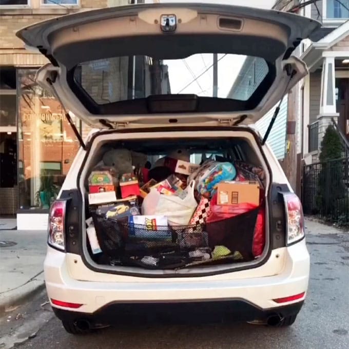 A trunk full of toys being donated to Toys for Tots by Commonwealth Barbershop
