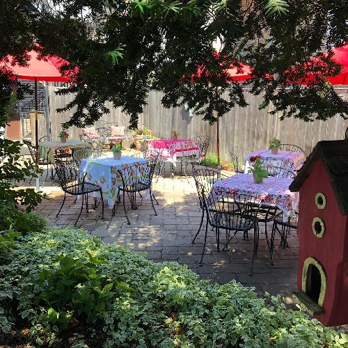 Tuscan Hen's quiet, green patio, which is open for brunch on Mother's Day